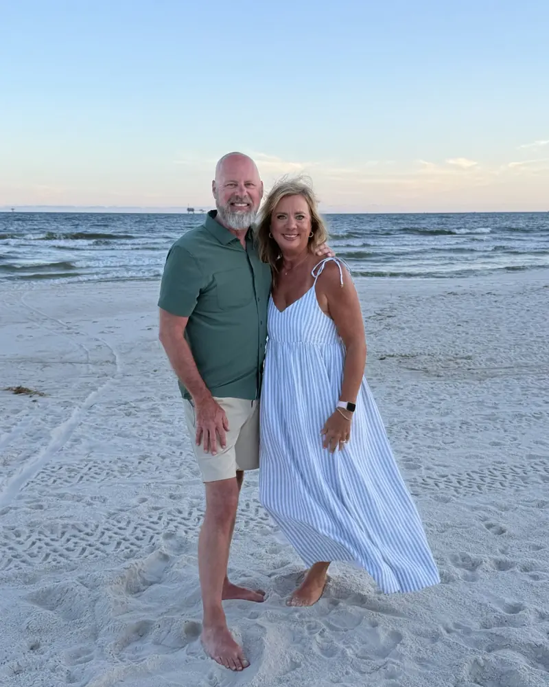 Joe and Danielle Cook on the beach at sunset